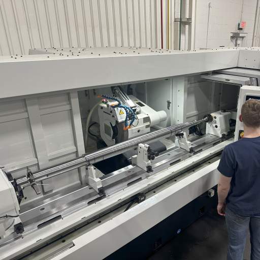 CNC Cylindrical Grinder Finishing a Turbine Shaft