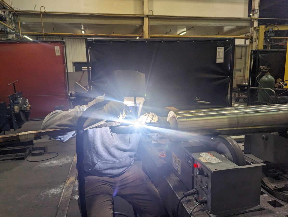 Hardfacing weld overlay applied to a journal diameter at HFW Industries.