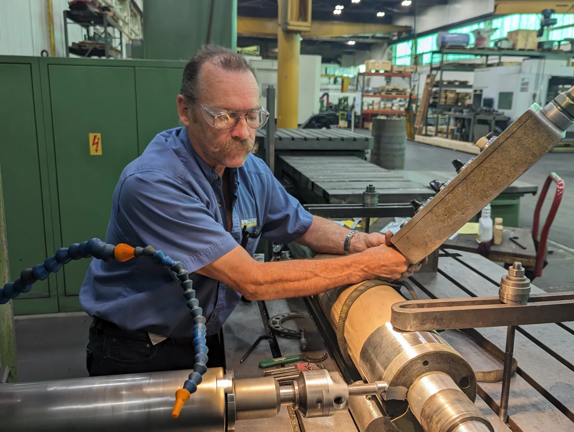 HFW Industries supervisor overseeing precision manufacturing operations