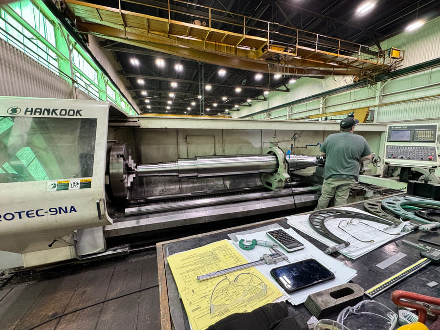 CNC lathe machining a compressor shaft for turnkey manufacturing at HFW Industries