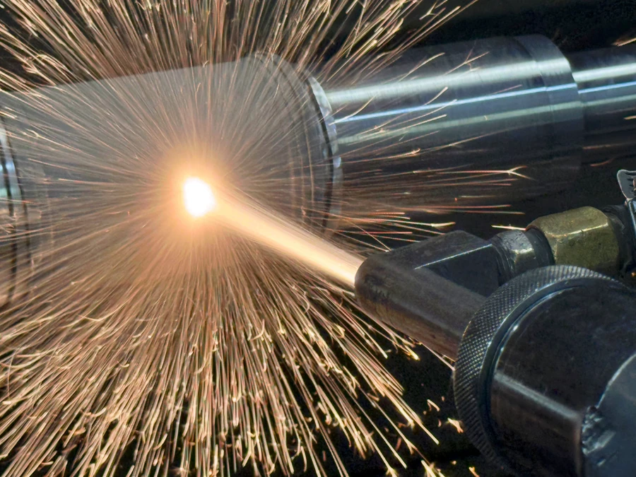 HVOF Spraying a Turbine Shaft | HFW Industries HVOF thermal spray coating applied to a turbine shaft at HFW Industries